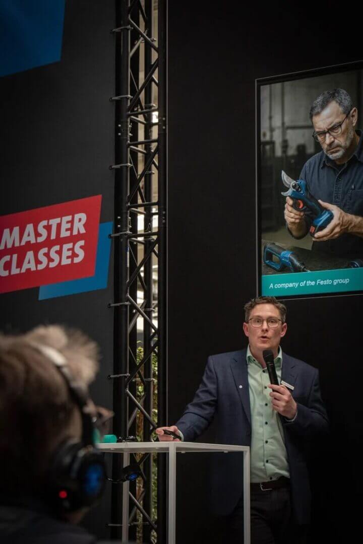 Speaker at Festo Masterclasses with microphone