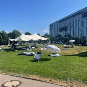 Outdoor summer party with tents and chairs